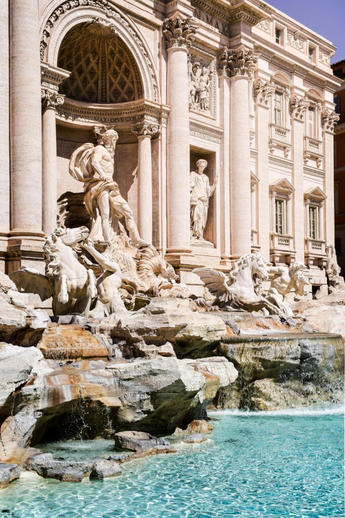 Stunning view of the iconic Trevi Fountain in Rome, showcasing intricate sculptures and flowing water.